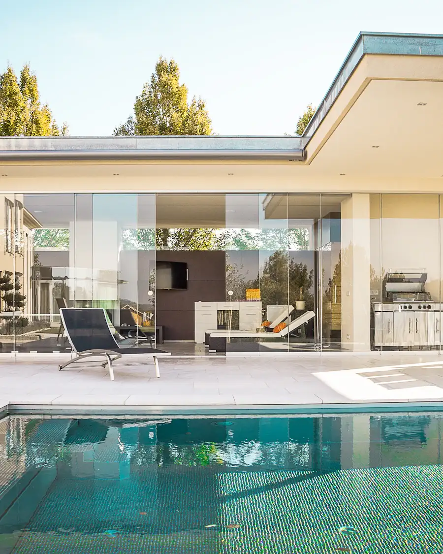 Glass-walled house with a pool